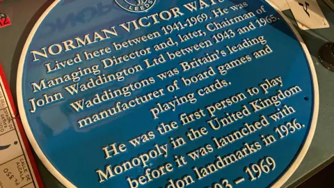 BBC / Cara Thorpe A Leeds Civic Trust plaque for Norman Victor Watson who was the first in the UK to play a game of Monopoly in Horsforth, Leeds