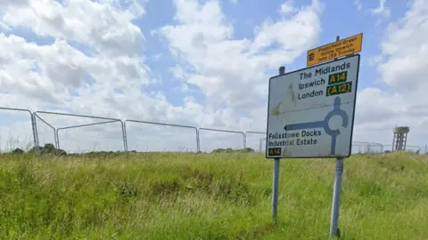 Google Maps A road sign in Felixstowe coming out of a piece of land