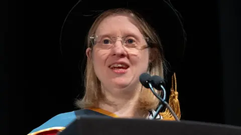 Jen Blackwell in graduation robes as she gave a speech on receiving an honorary degree 