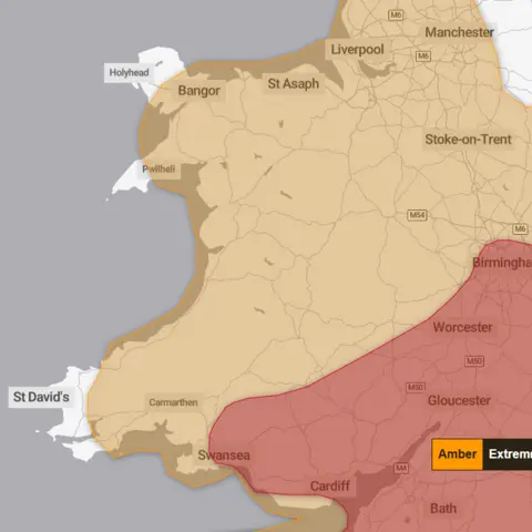 Met Office A map of Wales covered in an orange weather warning. South east Wales is also covered by a red weather warning. 