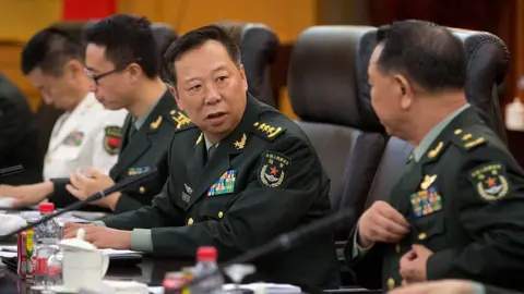 AFP/Getty Images China's People's Liberation Army (PLA) General Li Zuocheng (C) speaks during a meeting with unseen US Army Chief of Staff General Mark Milley at the Bayi Building in Beijing on 16 August 2016.