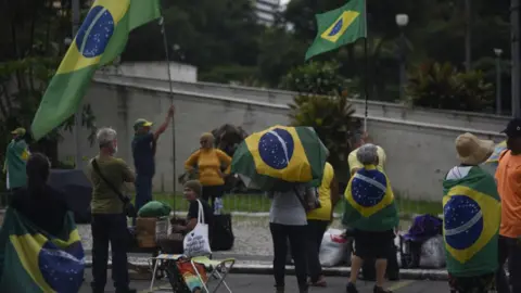 Getty Images Supporters of Jair Bolsonaro in Rio de Janeiro on Monday