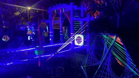 BBC Light sculptures which include green, orange and pink strobe lighting