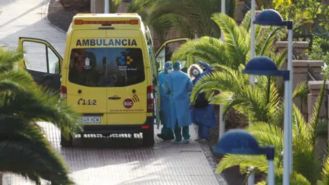 Reuters A tourist affected by "coronavirus" is transferred to a hospital from the hotel H10 Costa Adeje Palace, which is on lockdown after novel coronavirus has been confirmed in Adeje, on the Spanish island of Tenerife, Spain