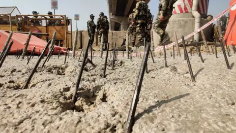 Iron nails embedded in the road at Tikri