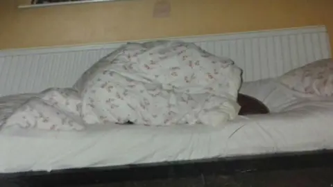 Other Andy wrapped up in the duvet