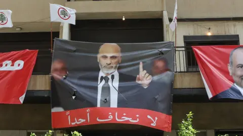 A banner in Ain al-Remmaneh Lebanon, showing Samir Geagea, the leader of the Christian Lebanese Forces (LF) party, that says: "We fear no-one" (16 May 2022)