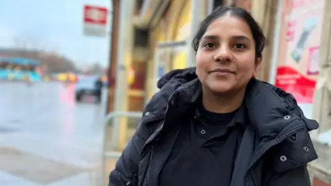 Stuart Woodward/BBC Yoginder Sandhu outside the station