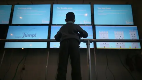 Getty Images Child at a massive screen