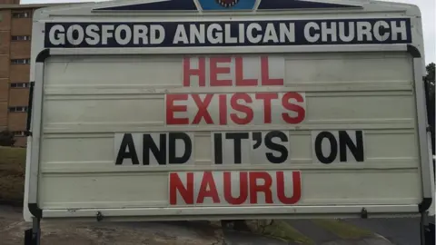 ROD BOWER Gosford Anglican Church billboard reads: "Hell exists and it's on Nauru'