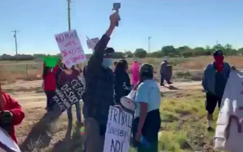 Bea Redfeather  Dozens of Shiprock residents protest against cannabis farms holding signs reading: Resist marijuana farms