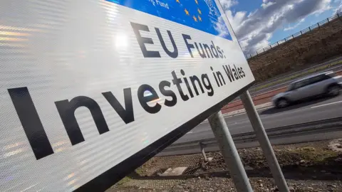 Getty Images A car passes a European Union funding sign on the newly opened A465 near Ebbw Vale