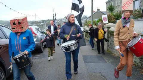 Gavan Goulder Cath (centre) on a First NOT second homes march