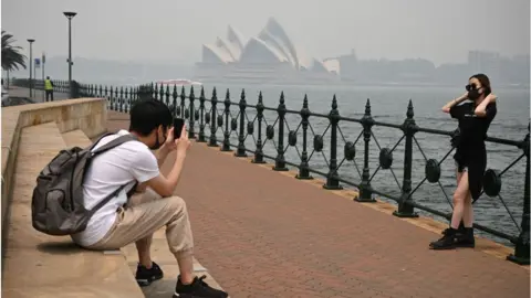 Getty Images December 2019 saw tourists in Sydney don masks to cope with wildfire smoke