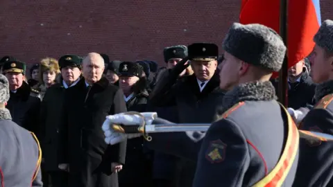 EPA Russian President Vladimir Putin (C-L) and Defence Minister Sergei Shoigu (C-R) attend a ceremony in the Alexander Garden to mark the Defender of the Fatherland Day in Moscow, Russia, 23 February 2023.