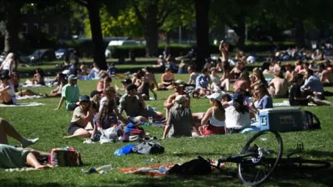 EPA People enjoyed picnics in London Fields park in east London.