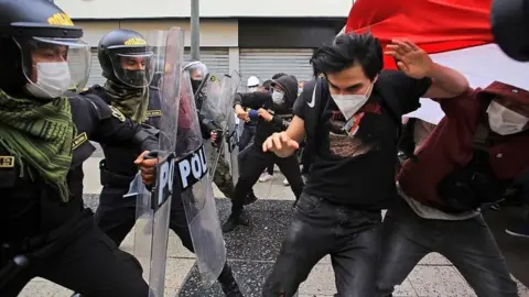 EPA Demonstrators clash with police during a protest in Lima, Peru, on 10 November 2020