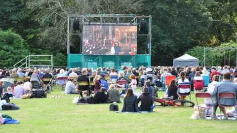 BBC Big screen in Guernsey's Saumarez Park showing the state funeral of Queen Elizabeth II