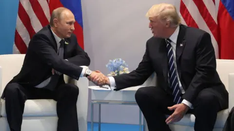 AFP/Getty Images Vladimir Putin and Donald Trump shake hands