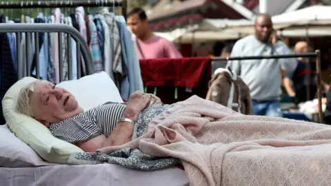 Entelechy Arts Performance artist in bed