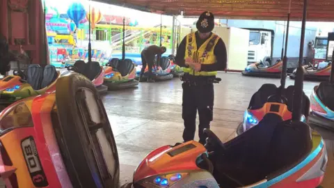 Twitter Officer writing a ticket