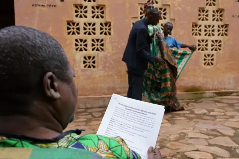 Clair MacDougall Man reading a script