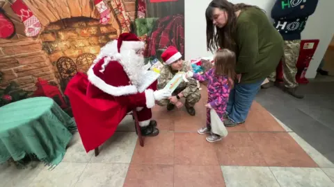 Santa with Maz Ormonde and her daughter florence