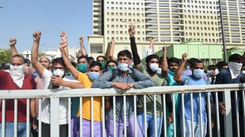 Getty Images Nursing staff under private contract at a protest