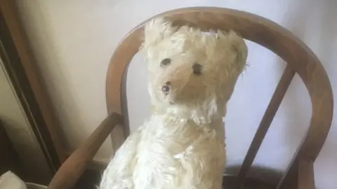 Dominic Winter Auctioneers An image of a golden Steiff bear.