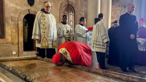 Reuters Archbishop Pierbattista Pizzaballa, leads Easter Sunday Mass in the Church of the Holy Sepulchre in Jerusalem's Old City