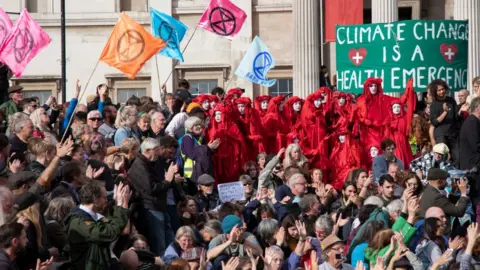 Getty Images Protestors in Trafalgar Square