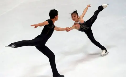 Reuters FILE PHOTO: Figure Skating - Olympic Qualifying ISU Challenger Series - Pairs Free Skating - Oberstdorf, Germany - September 29, 2017 - Ryom Tae-Ok and Kim Ju-Sik of North Korea compete.