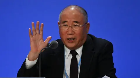 Getty Images China's special climate envoy, Xie Zhenhua, speaks during a joint China and US statement on a declaration enhancing climate action in the 2020s on November 10, 2021 in Glasgow, Scotland