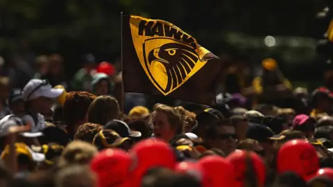 Getty Images A Hawthorn team flag flies above a crowd