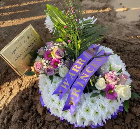 Family photo Flowers and a plaque put in place at the funeral of Anami Liaquat on 22 February 2022