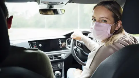 Getty Images Driver wearing face covering