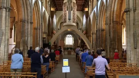 BBC The congregation followed social distancing rules at Llandaff cathedral as they attended Sunday service