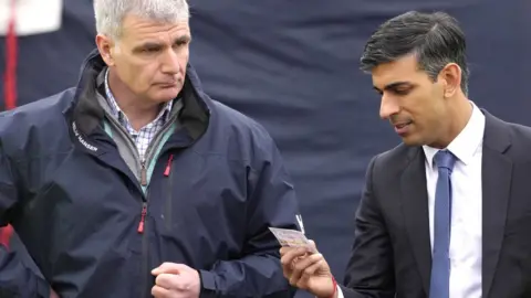 Getty Images Rishi Sunak visits Home Office staff in Dover