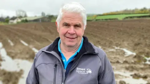 BBC William Gilmore standing in a field