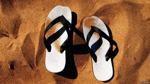 Getty Images Picture of Jandals in sand