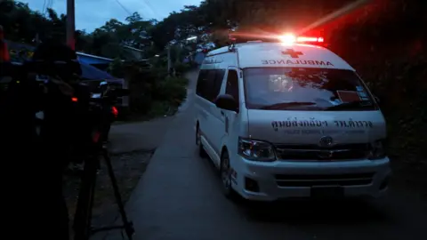 Reuters An ambulance with sirens on speeds away from the scene where children were rescued