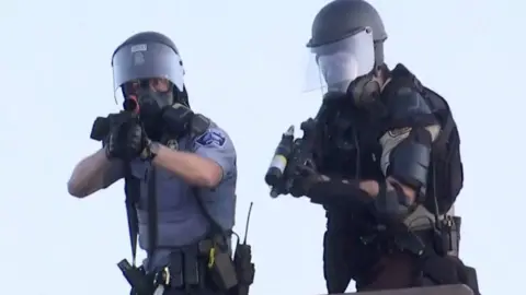 Reuters Police aim at a Reuters TV cameraman during nationwide unrest following the death of of George Floyd in Minneapolis police custody, in Minneapolis, Minnesota,