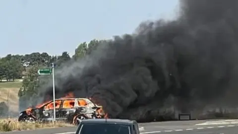 Cambs fire and rescue Car in fire