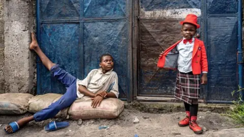 Tariq Zaidi Israell Mbona and older child