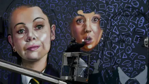 Reuters A mural of the characters of Derry Girls in the city