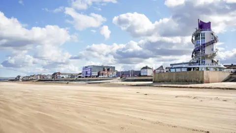 Redcar & Cleveland Borough Council A tower and sea front buildings beside a beach