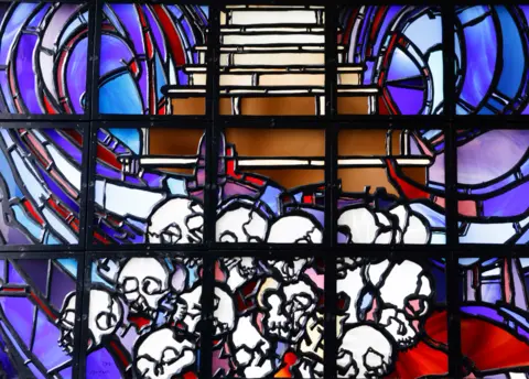 AFP Windows of Hope by artist Ardyn Halter, the son of Auschwitz survivor Roman Halter, decorates the Kigali Genocide Memorial, in Rwanda - Wednesday 26 May 2021