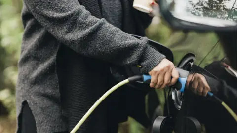 Getty Images Charging a car - stock shot