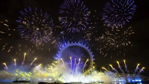 EPA-EFE/REX/Shutterstock Blue and yellow fireworks light up the sky above London in support of Ukraine