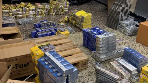 Stoke-on-Trent City Council Boxes of cigarettes on a shop floor